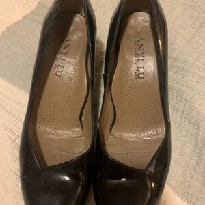 Patent black pumps with tortoise shell heels